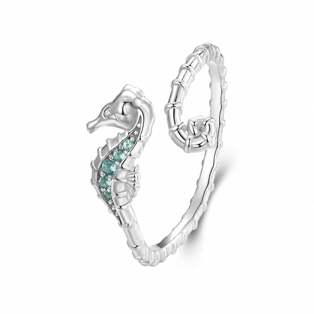 Seahorse ring styled with other silver jewellery