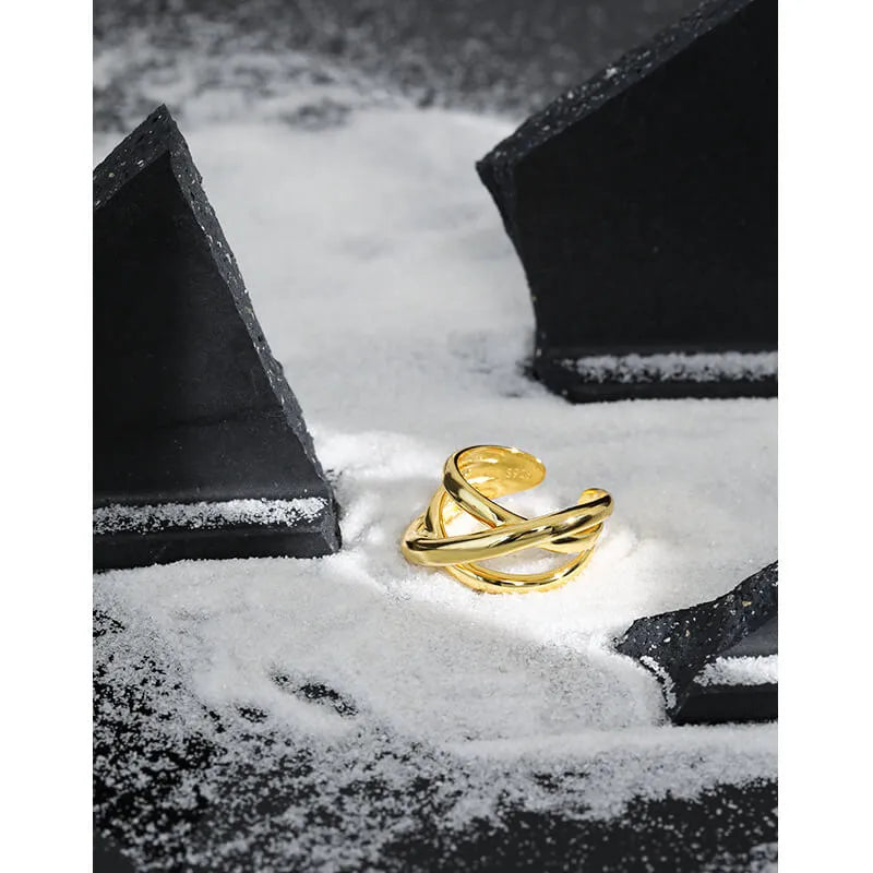 Triple Line silver crossover ring with a woven three-line design in 925 sterling silver