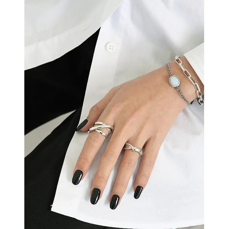 Triple Line silver crossover ring with a woven three-line design in 925 sterling silver