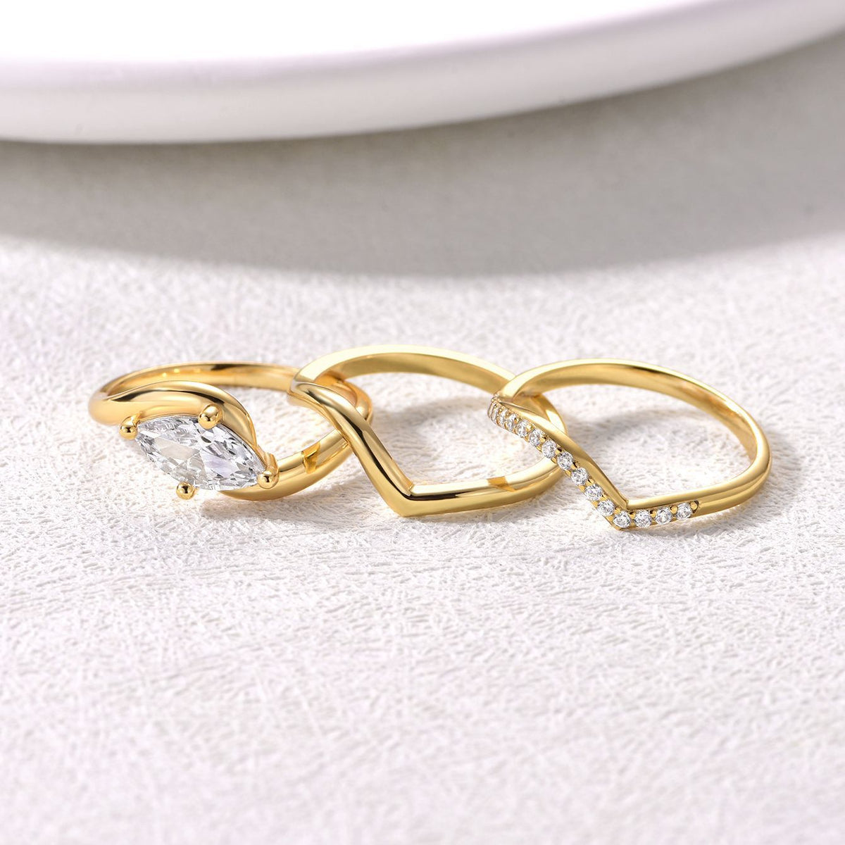 Marquise wave ring set separated into three individual bands