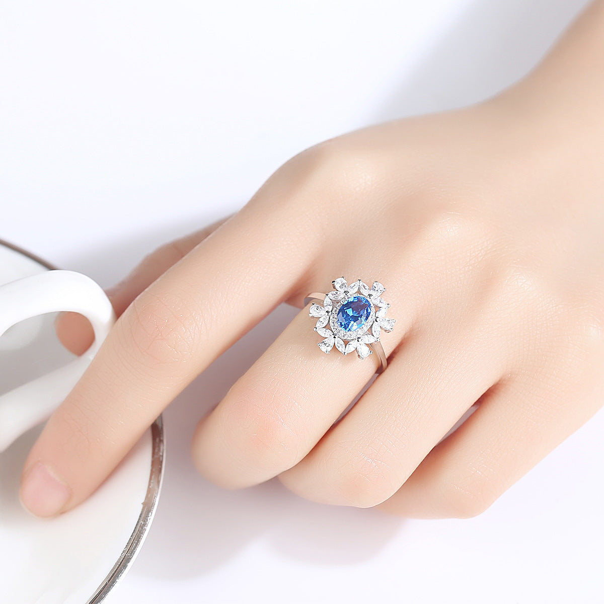 Floral petal ring in sterling silver worn on hand