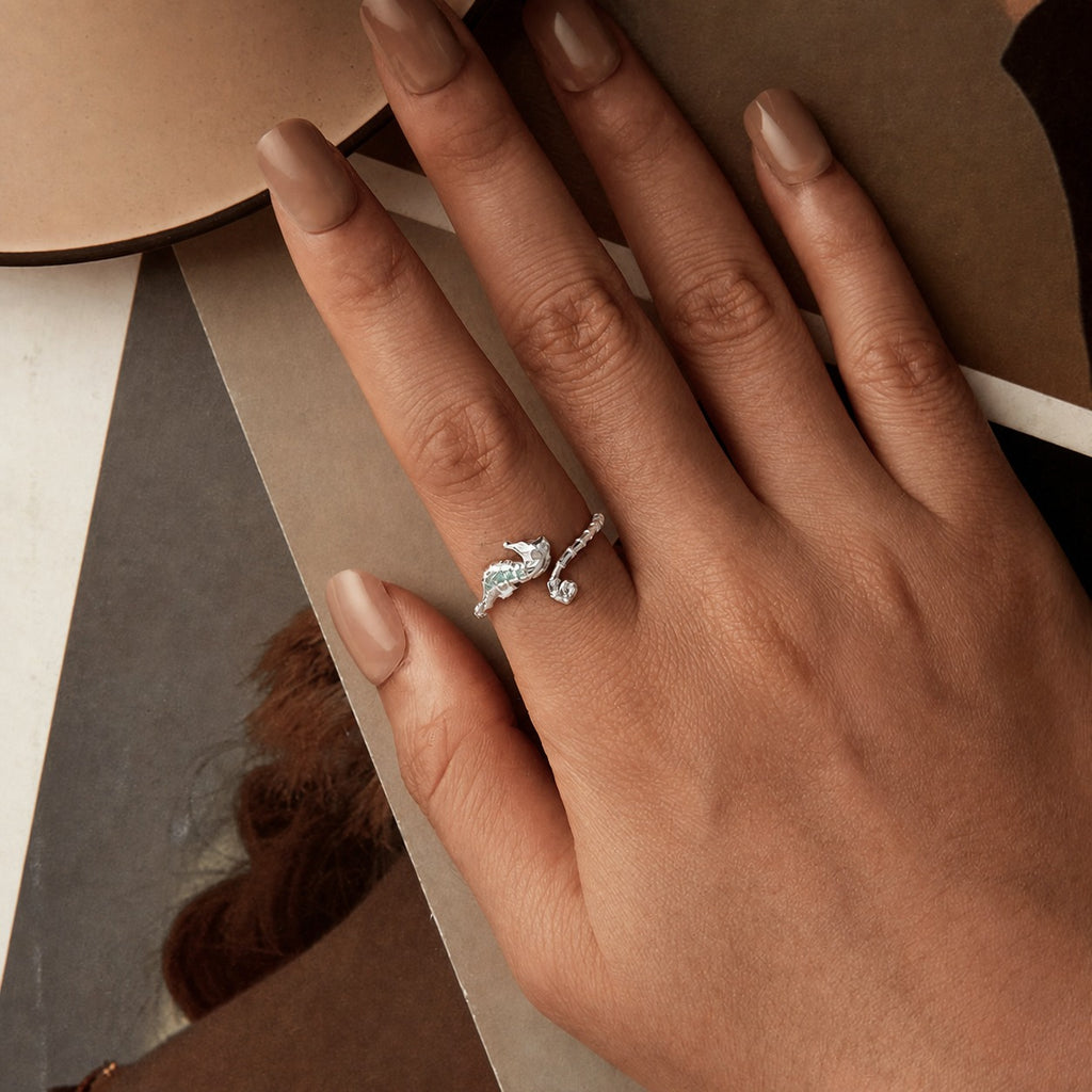 Seahorse ring in sterling silver worn on hand